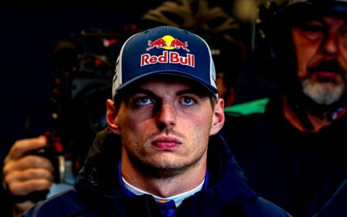 Max Verstappen wearing his racing suit in the pit lane at the Nurburgring 24 Hours