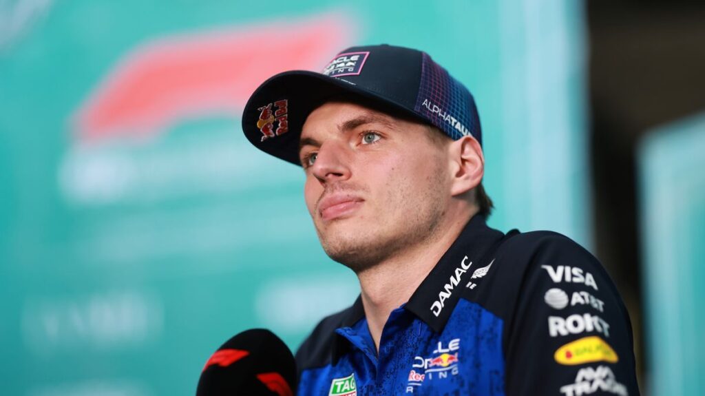 Max Verstappen looking thoughtful in his Red Bull racing suit
