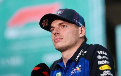 Max Verstappen looking thoughtful in his Red Bull racing suit