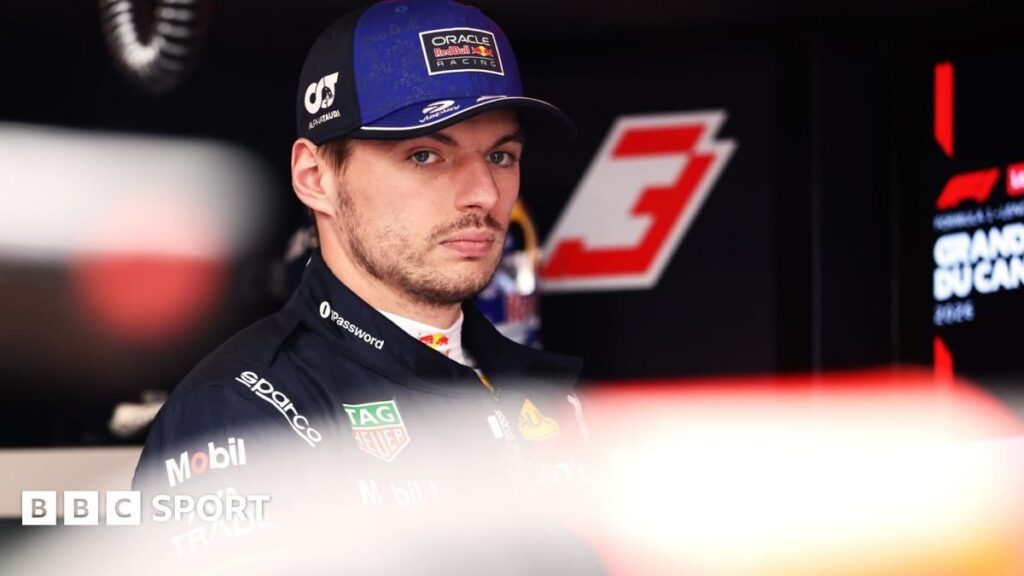 Max Verstappen looking frustrated in Red Bull racing gear at the Canadian Grand Prix