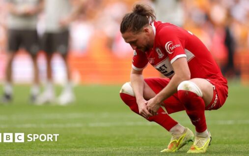 Dejected Middlesbrough players on the Wembley pitch after losing the play-off final to Hull City