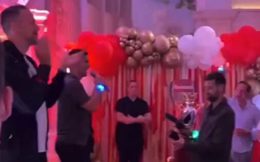 Mikel Arteta addressing Arsenal fans with a microphone during Premier League title celebrations