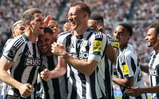 Newcastle United players celebrating a goal against Brighton at St James' Park
