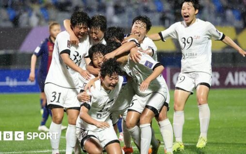 North Korean football players from Naegohyang celebrating their 2-1 victory on the pitch