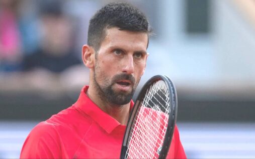 Novak Djokovic speaking into a microphone at a French Open press conference