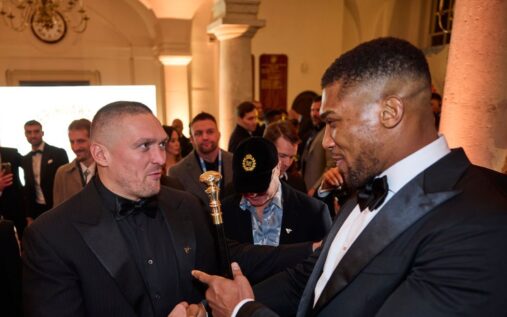 Oleksandr Usyk and Anthony Joshua embrace in the boxing ring