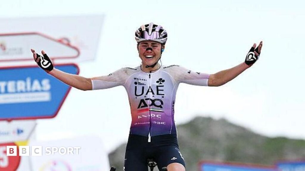 Paula Blasi celebrating her overall victory at the women's Vuelta a Espana on the L'Angliru climb