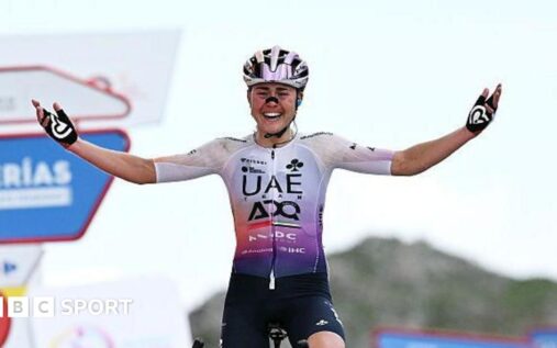 Paula Blasi celebrating her overall victory at the women's Vuelta a Espana on the L'Angliru climb