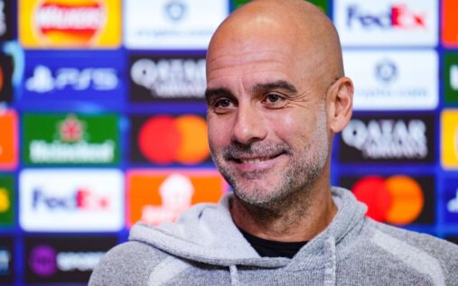 Pep Guardiola gesturing on the touchline during a Manchester City Premier League match