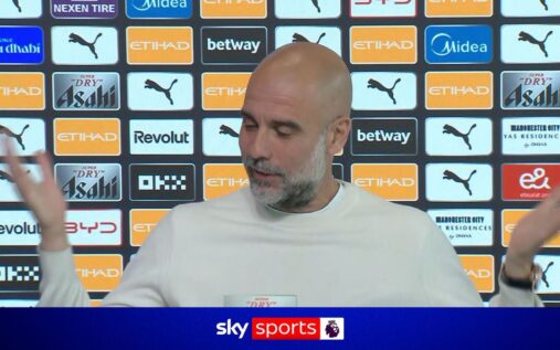 Pep Guardiola watching a football match from the stadium stands