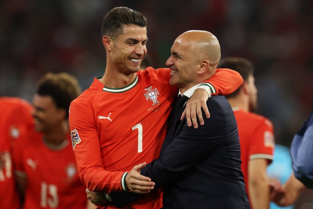 Portugal manager Roberto Martinez and forward Cristiano Ronaldo in conversation on the pitch