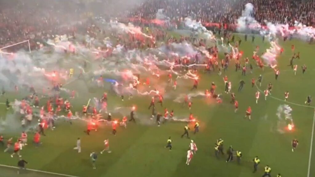 Thick smoke from pyrotechnic flares covers the pitch during the abandoned Czech First League derby in Prague