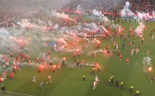 Thick smoke from pyrotechnic flares covers the pitch during the abandoned Czech First League derby in Prague