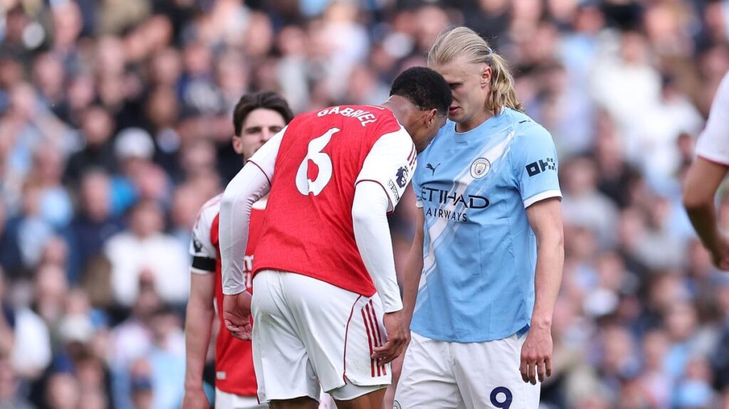 Arsenal defender Gabriel Magalhaes squaring up to Manchester City striker Erling Haaland
