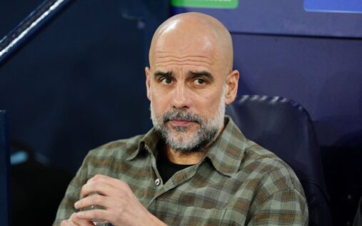 Manchester City manager Pep Guardiola standing on the touchline during a Champions League match against Real Madrid