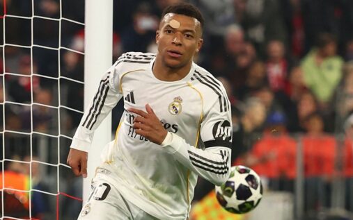 Kylian Mbappe in a Real Madrid kit looking focused ahead of a match