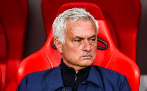 Jose Mourinho looking serious on the touchline while managing in a suit