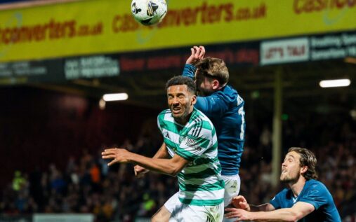 Referee pointing to the penalty spot during a Scottish Premiership match
