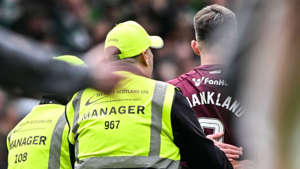 Referee Don Robertson officiating a Scottish Premiership match between Celtic and Hearts