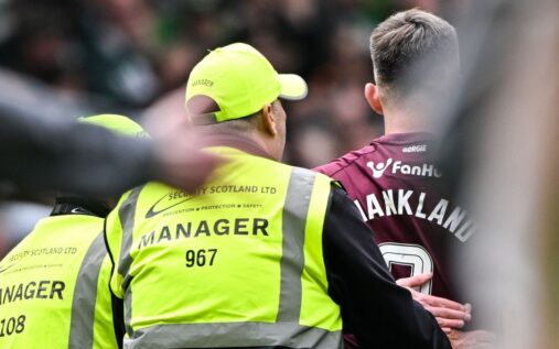 Referee Don Robertson officiating a Scottish Premiership match between Celtic and Hearts