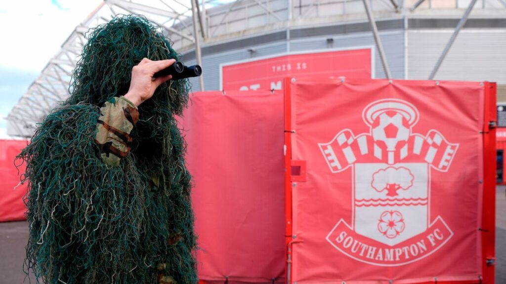 Dejected Southampton fans looking frustrated in the stands during a Championship football match