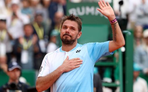 Stan Wawrinka hitting a backhand on a clay court during a tennis match