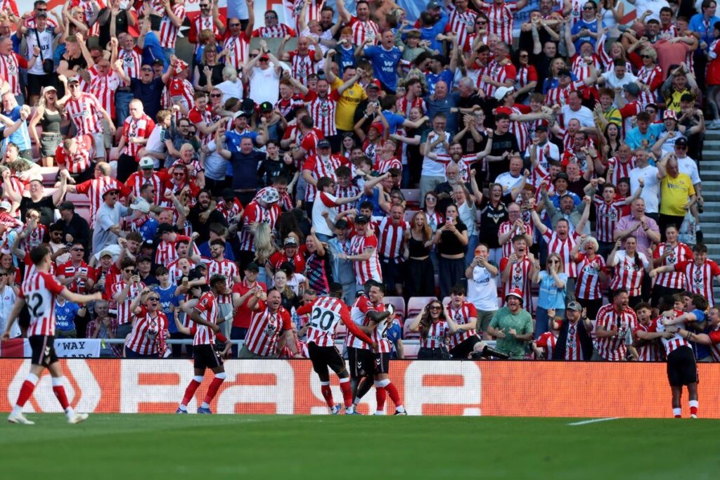 Sunderland players celebrate securing Europa League qualification after defeating Chelsea in the Premier League