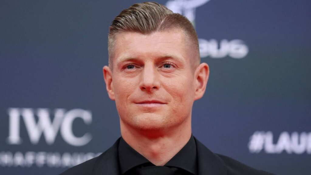 Toni Kroos looking serious while standing on a football pitch
