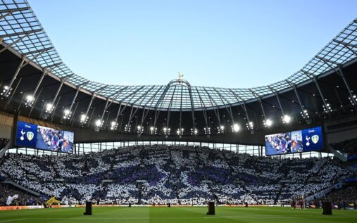 Tottenham Hotspur fans holding protest banners in the stands during a Premier League match