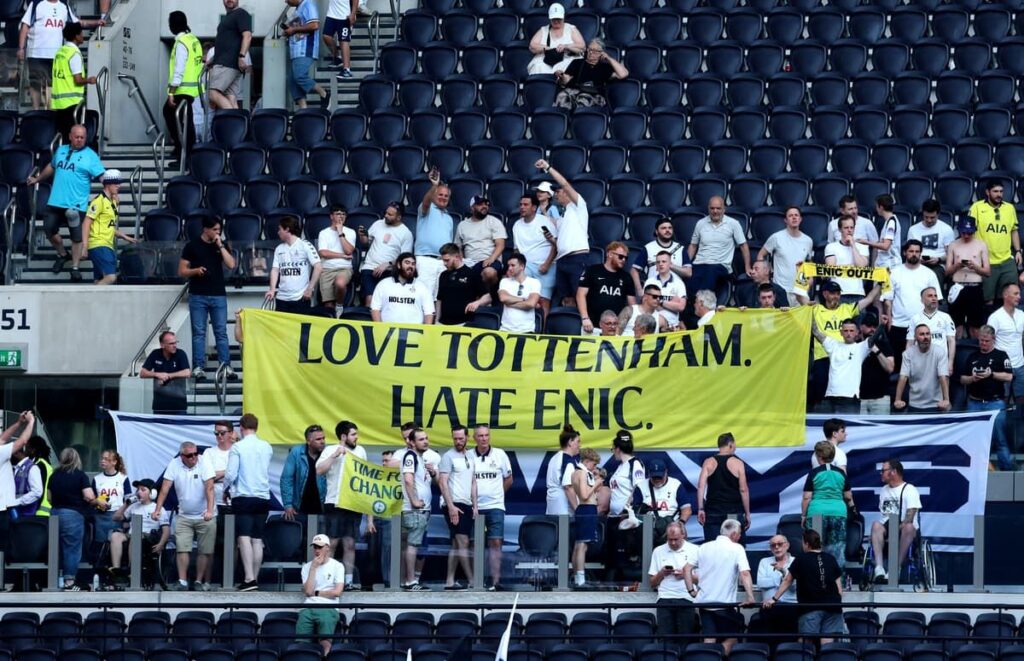 Tottenham Hotspur fans holding protest banners against ENIC ownership in the stadium stands