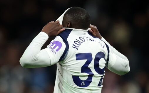 Tottenham Hotspur players looking dejected on the pitch during a crucial Premier League relegation clash with Leeds United.