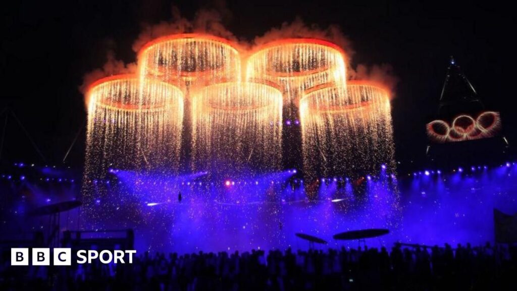 The Olympic rings displayed prominently at a stadium ahead of a major international sporting event