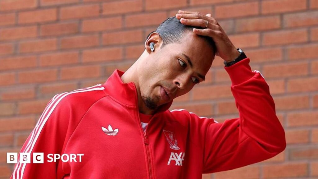 Liverpool captain Virgil van Dijk looking dejected on the pitch