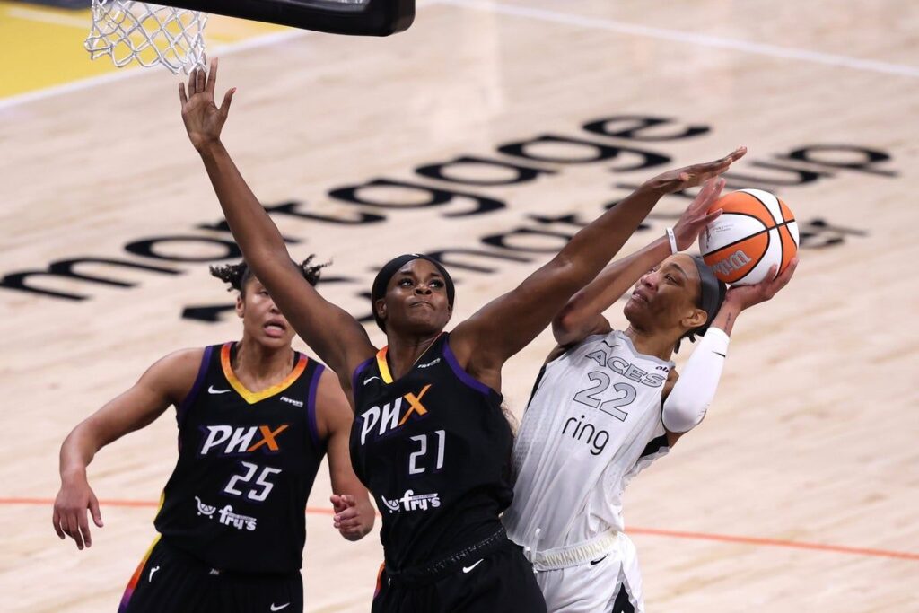 WNBA players competing on court during a professional basketball game