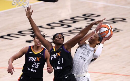WNBA players competing on court during a professional basketball game