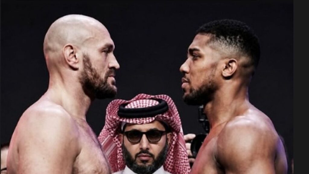 Anthony Joshua looking focused while standing in a boxing ring