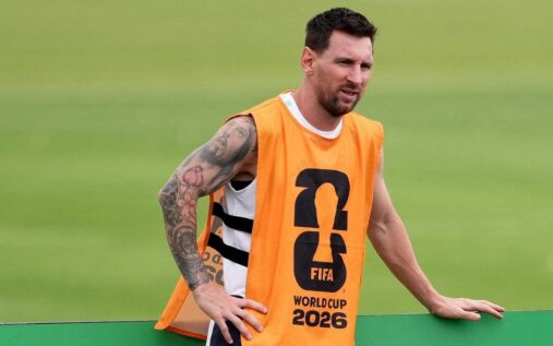 Argentina captain Lionel Messi looking thoughtful on the pitch wearing the national team kit
