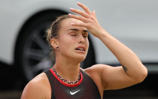 Aryna Sabalenka looking dejected on the tennis court during a match