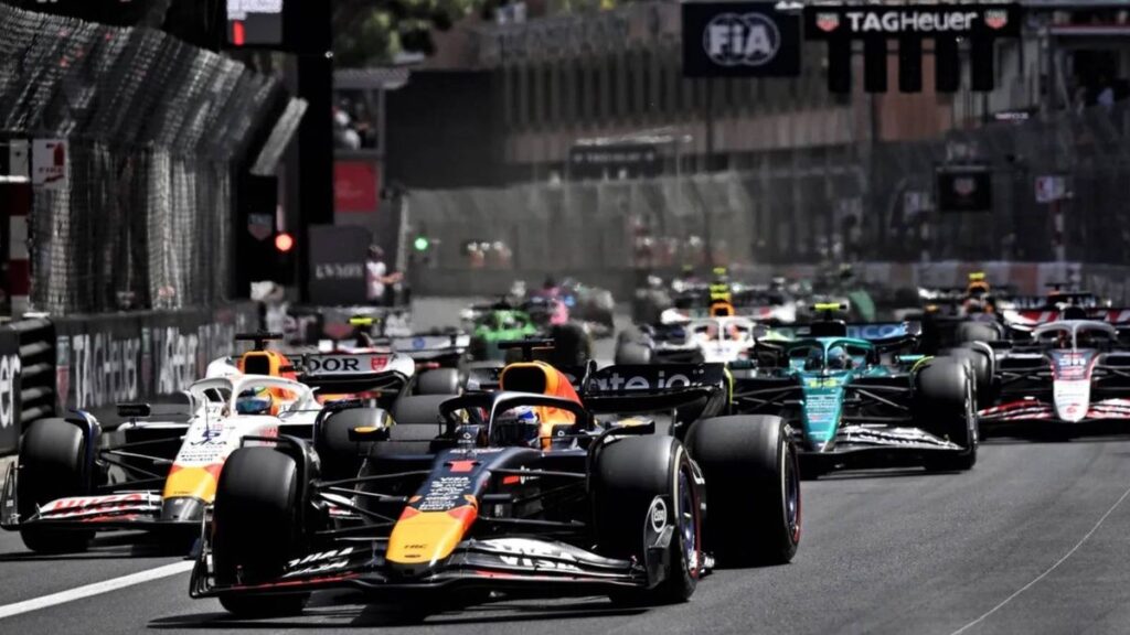 Aston Martin team owner Lawrence Stroll looking visibly frustrated in the Formula 1 paddock