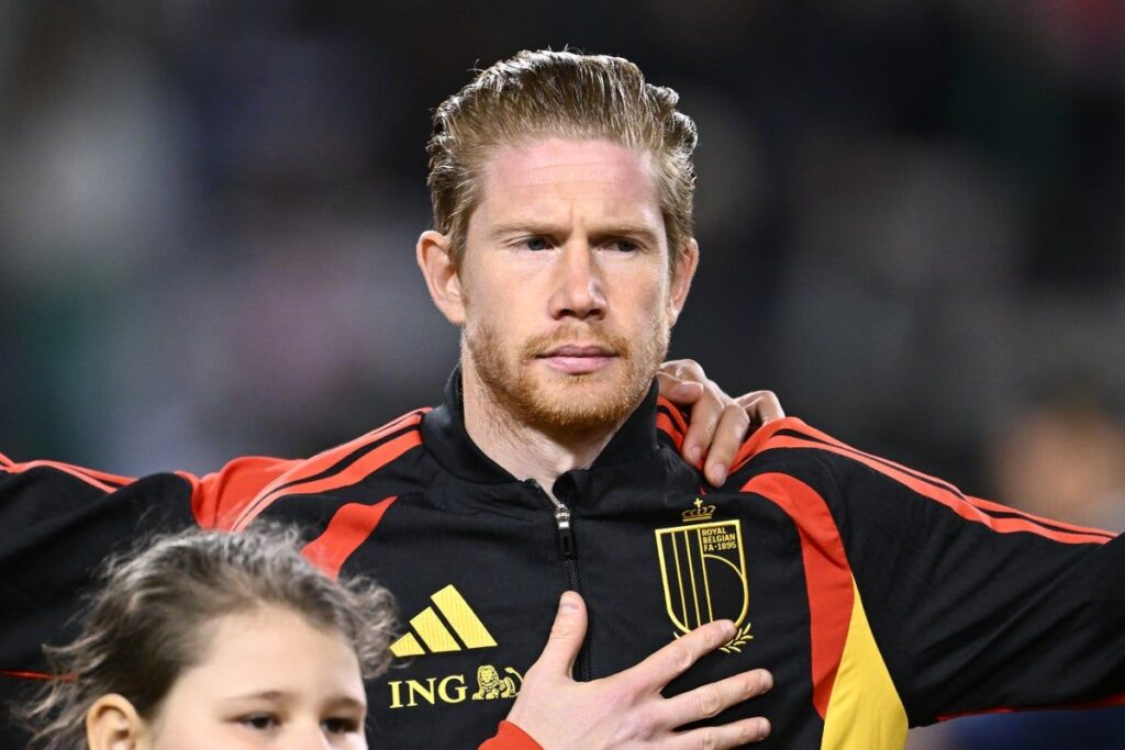Kevin de Bruyne and Romelu Lukaku lining up for the Belgium national team during a World Cup match