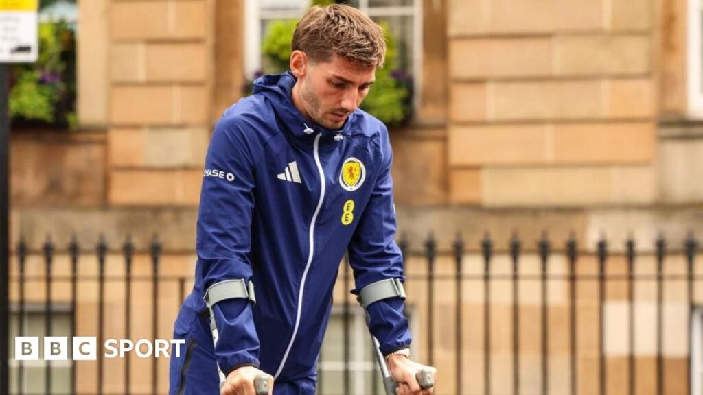 Scotland midfielder Billy Gilmour looking dejected on the pitch before his World Cup injury withdrawal