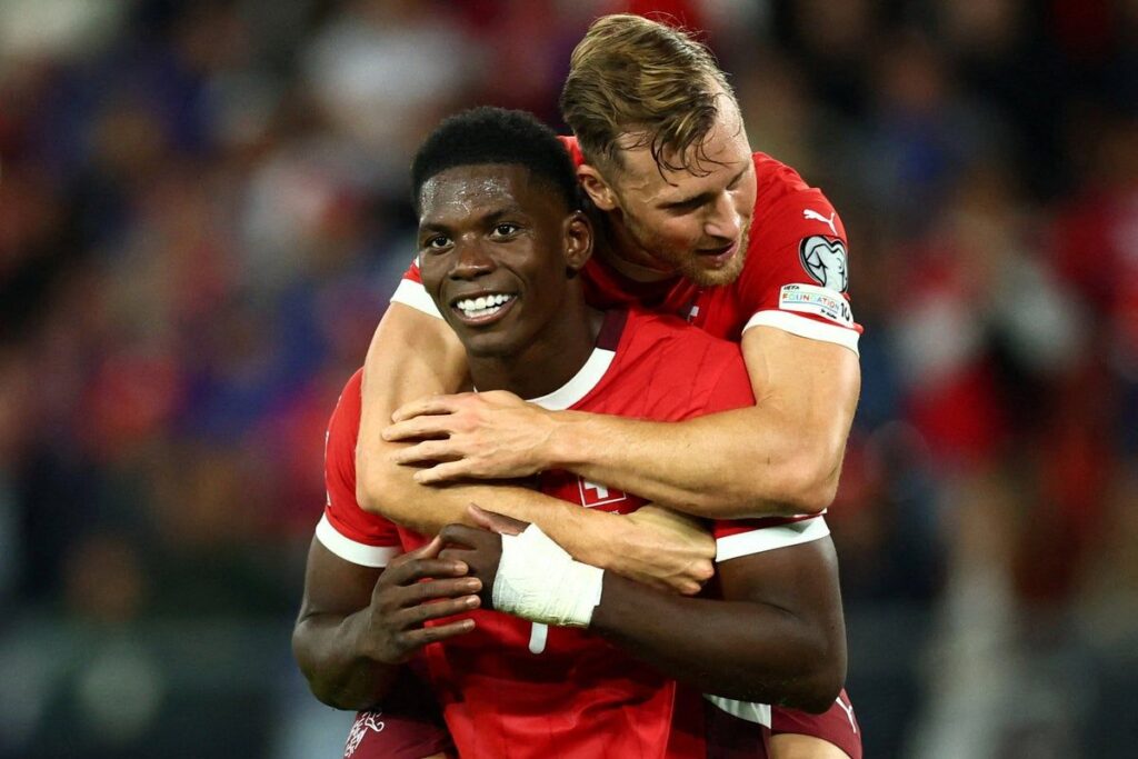 Switzerland striker Breel Embolo in action wearing his national team kit