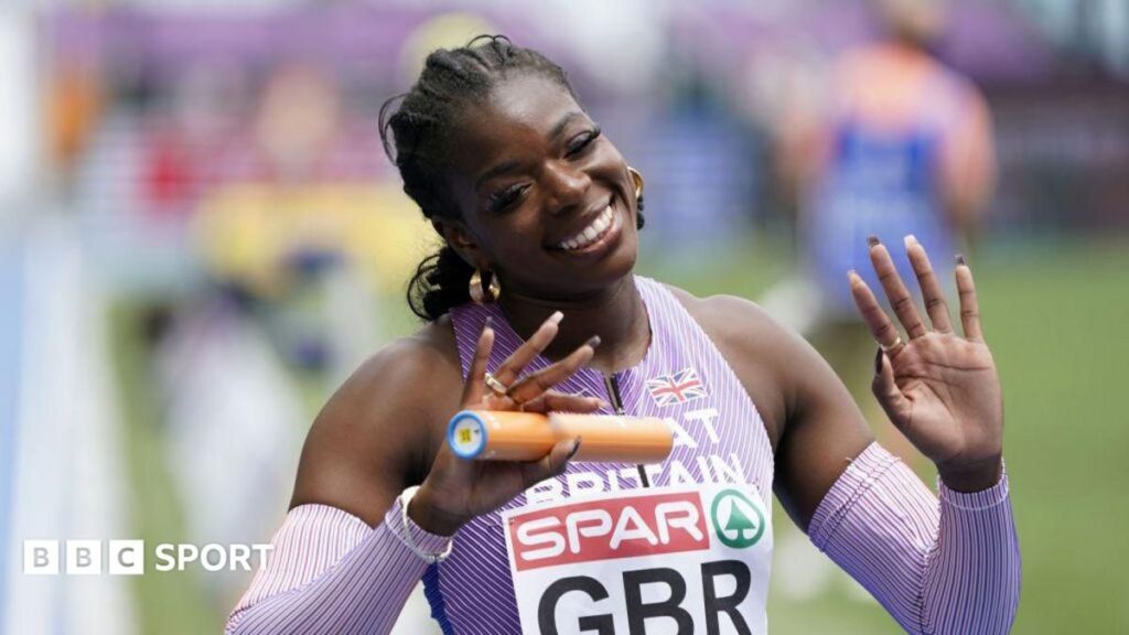 British sprinter Asha Philip smiling while competing in her Great Britain athletics kit