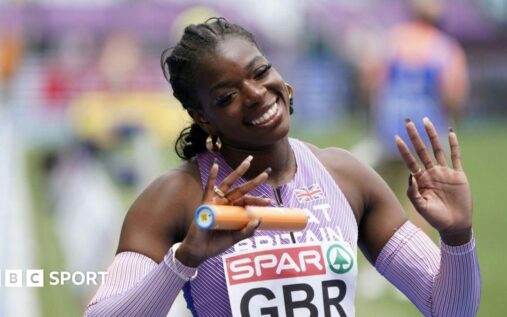 British sprinter Asha Philip smiling while competing in her Great Britain athletics kit
