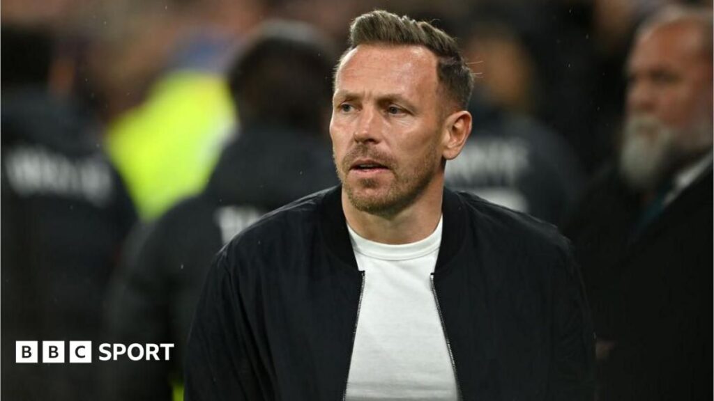 Wales manager Craig Bellamy gesturing on the touchline during an international football match