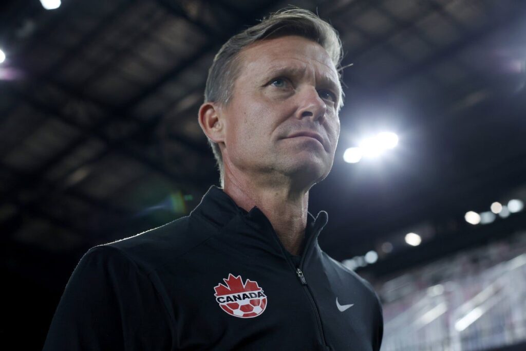 Canada men's national football team lining up on the pitch before an international match