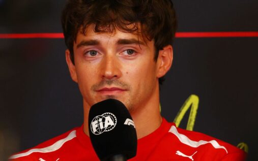 Charles Leclerc wearing his red Ferrari race suit in the paddock ahead of the Monaco Grand Prix