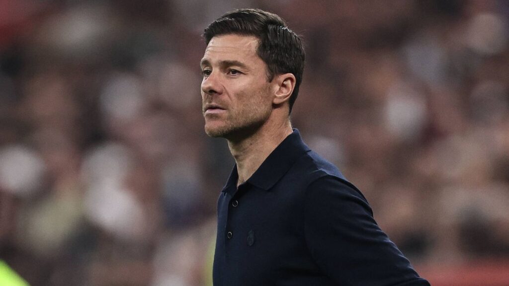Chelsea manager Xabi Alonso standing on the touchline looking thoughtful