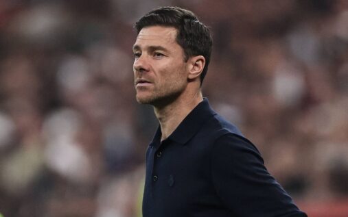 Chelsea manager Xabi Alonso standing on the touchline looking thoughtful