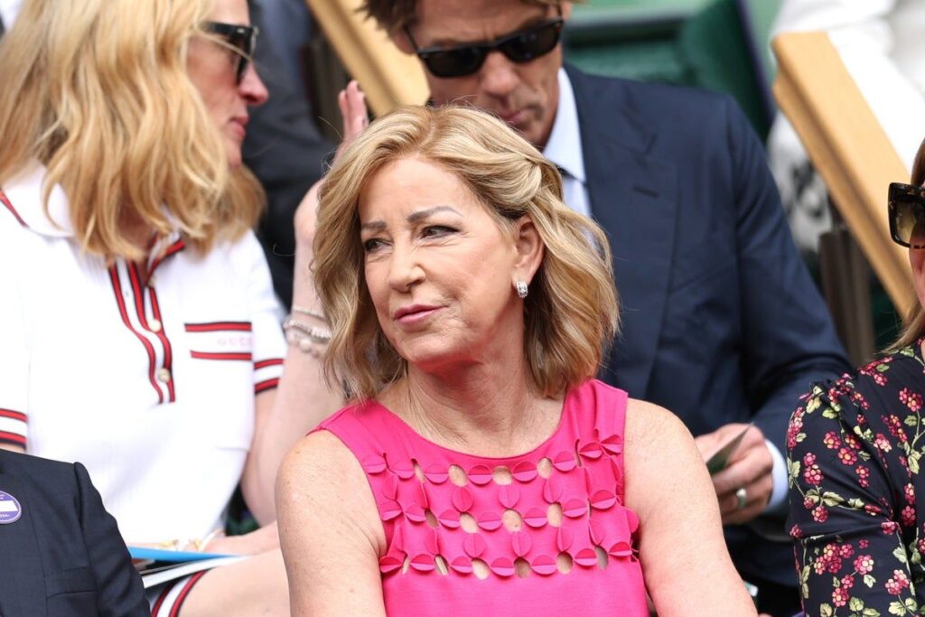 Chris Evert looking on from the commentary box at a major tennis tournament